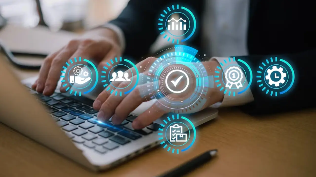 Close-up of hands on a laptop keyboard, surrounded by icons for business processes and a central checkmark, representing TechVerdi's CRM solutions.