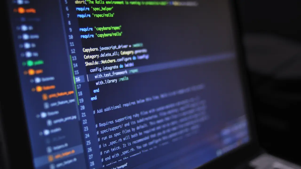 Close-up of computer screen displaying code for custom software development by a TechVerdi developer in Switzerland's Head Office.